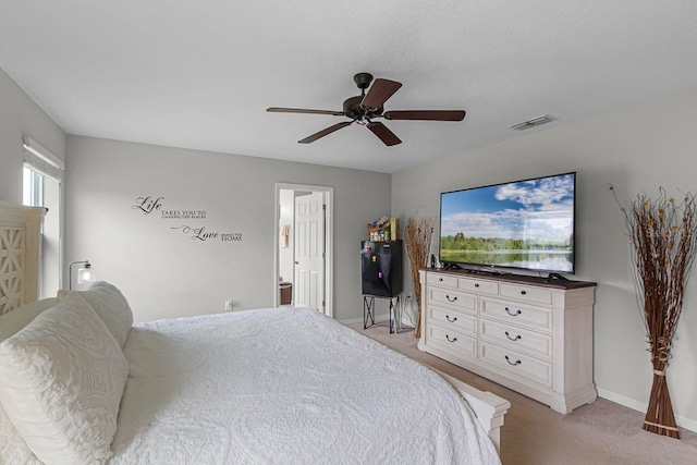 bedroom with light colored carpet and ceiling fan