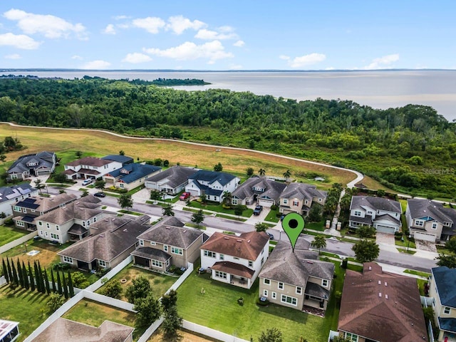 birds eye view of property with a water view