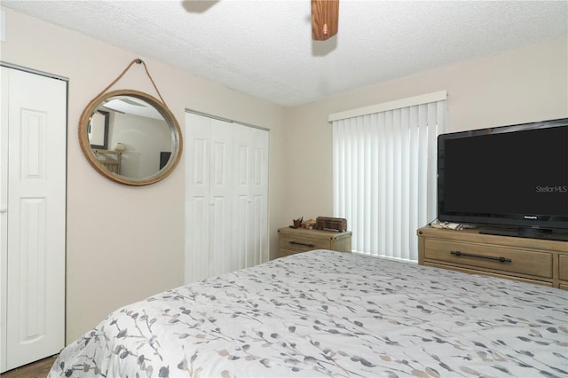 bedroom featuring a textured ceiling and ceiling fan