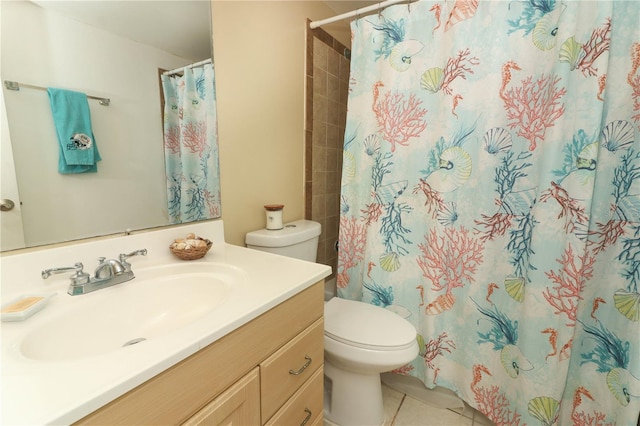 bathroom featuring vanity, toilet, tile patterned floors, and a shower with curtain