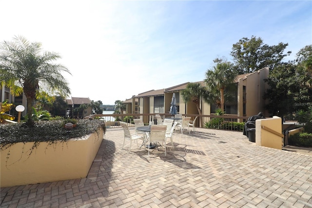 view of patio / terrace featuring a water view