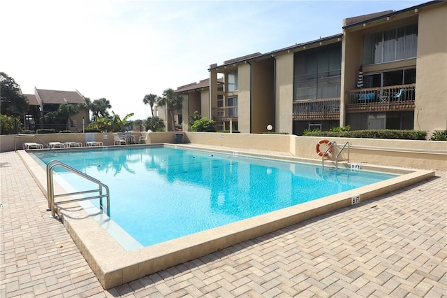 view of pool featuring a patio area