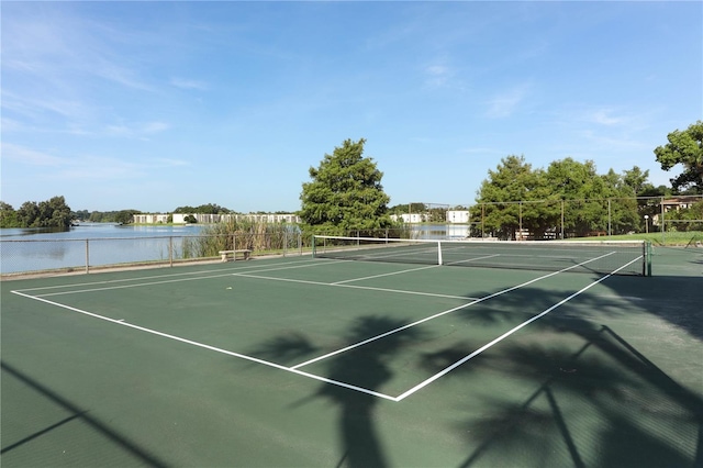 view of sport court with a water view