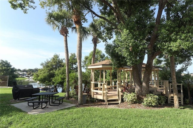 view of yard featuring a water view and a patio area