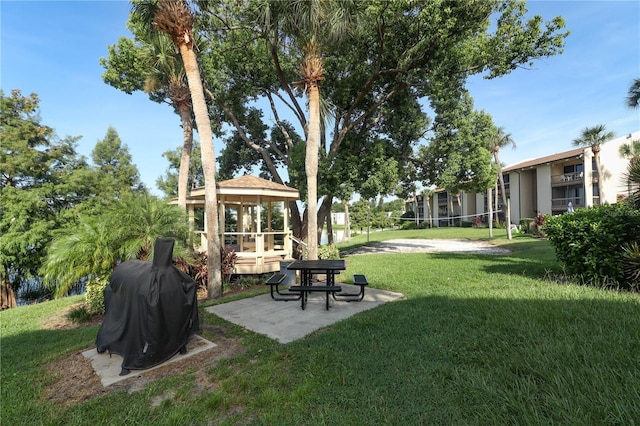 view of community featuring a lawn, volleyball court, and a gazebo