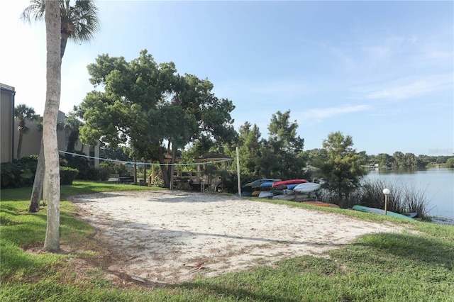 view of community featuring volleyball court and a water view