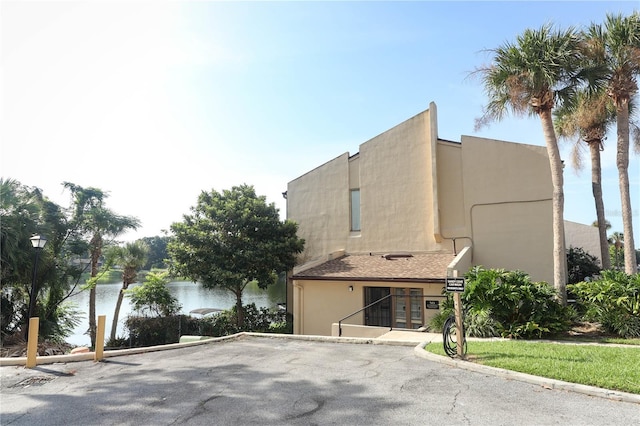 view of property with a water view