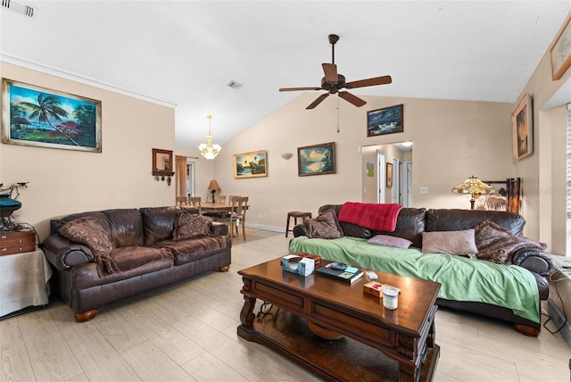 living room with vaulted ceiling, ceiling fan with notable chandelier, and light hardwood / wood-style flooring