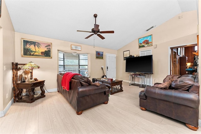 living room with vaulted ceiling, ceiling fan, and light wood-type flooring