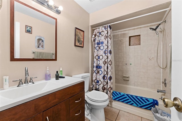 full bathroom featuring toilet, vanity, tile patterned flooring, and shower / bath combo with shower curtain