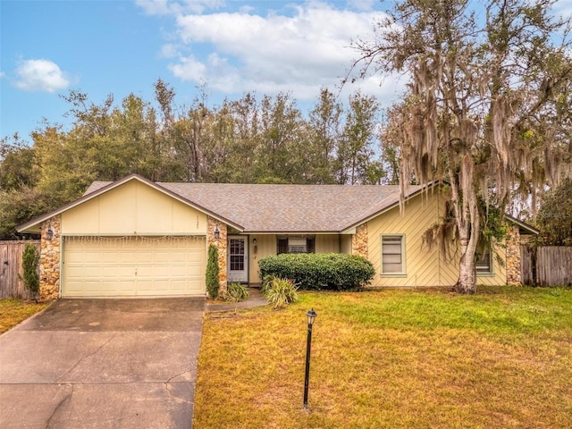 single story home featuring a garage and a front lawn