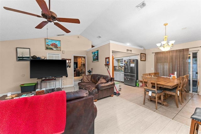 living room featuring vaulted ceiling, light tile patterned flooring, and ceiling fan with notable chandelier