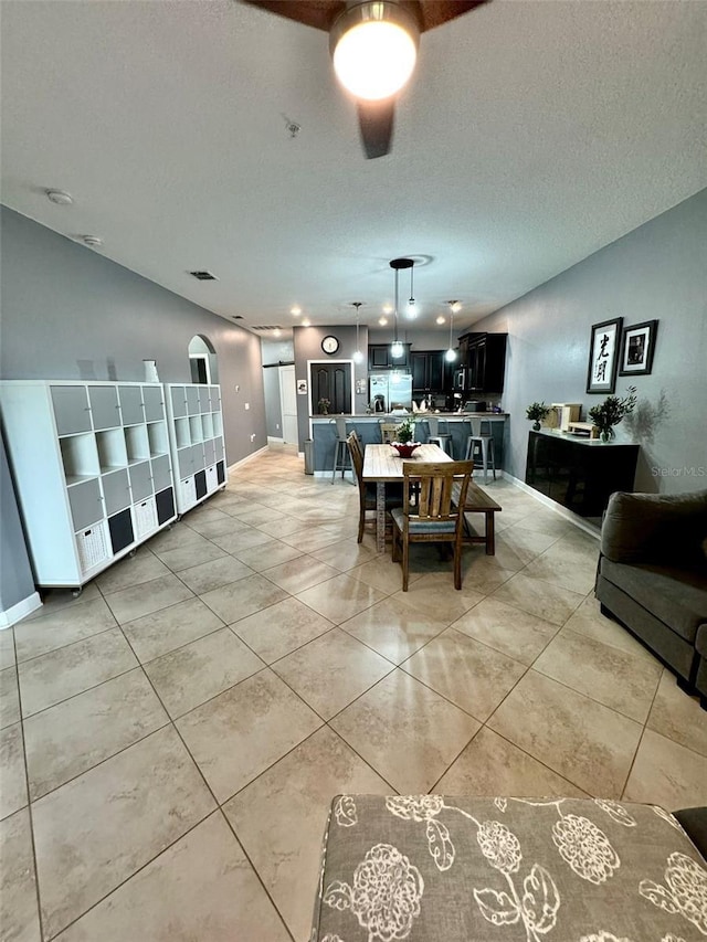 dining room featuring a textured ceiling