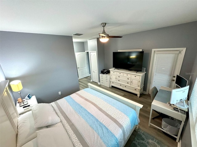 bedroom featuring ceiling fan and dark wood-type flooring