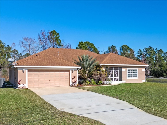 ranch-style home with a front yard and a garage