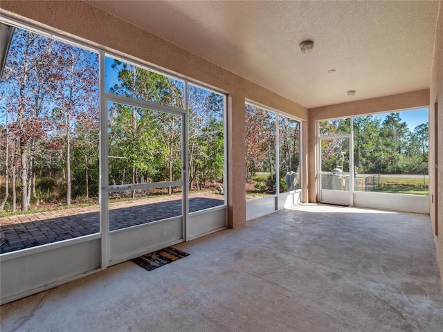 unfurnished sunroom with plenty of natural light