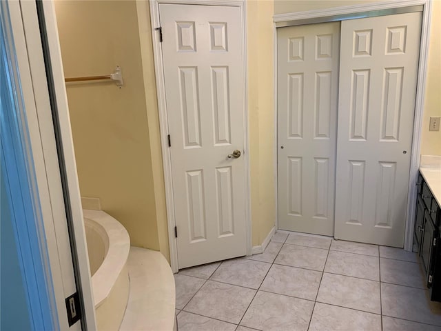 full bathroom featuring tile patterned flooring and vanity