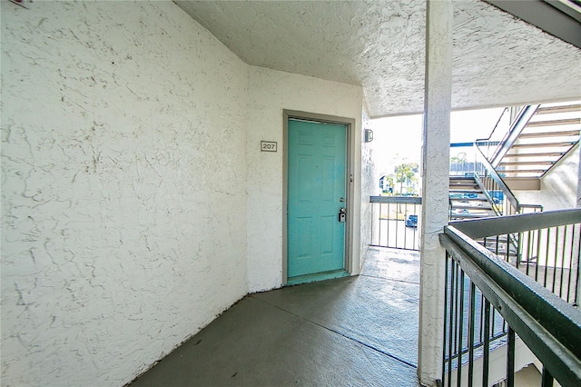 property entrance with a balcony