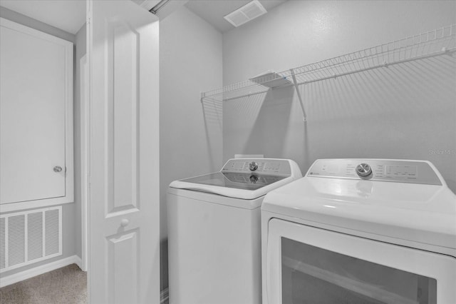 washroom featuring carpet floors and independent washer and dryer