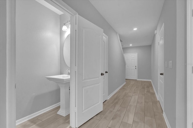 corridor featuring light hardwood / wood-style flooring