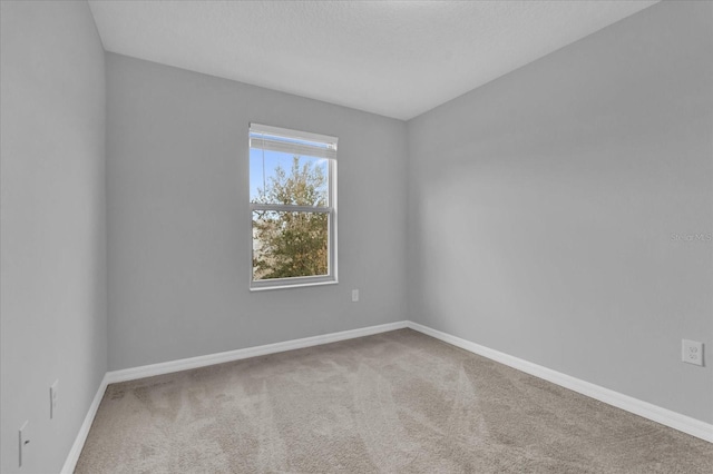 unfurnished room with carpet floors