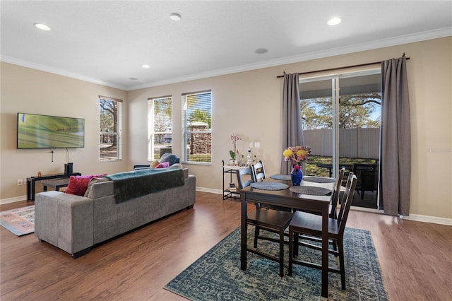 living room featuring wood-type flooring and ornamental molding