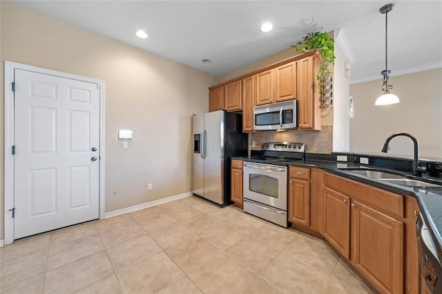 kitchen featuring stainless steel appliances, hanging light fixtures, crown molding, light tile patterned floors, and sink