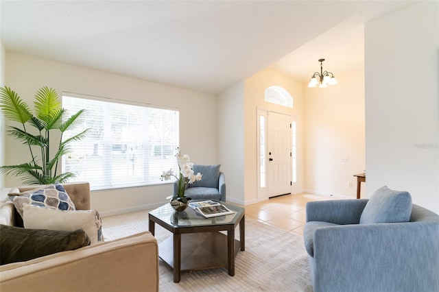 living room featuring light tile patterned flooring and a chandelier