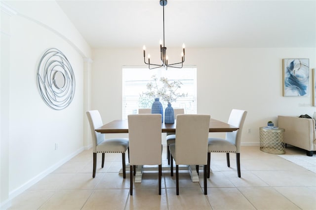 dining room featuring a chandelier and light tile patterned floors