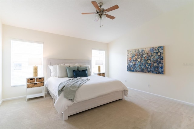 carpeted bedroom with lofted ceiling and ceiling fan