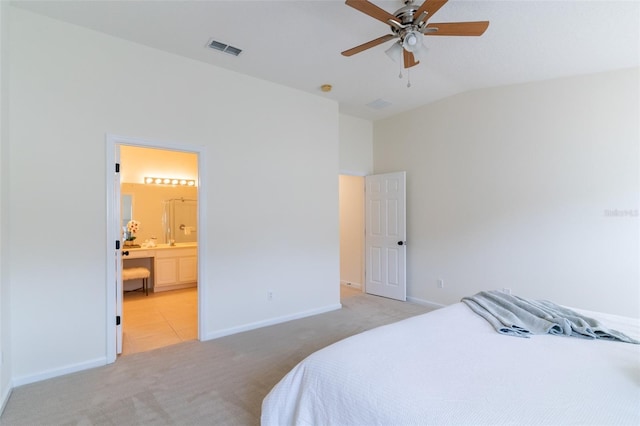 carpeted bedroom with lofted ceiling, ceiling fan, and connected bathroom