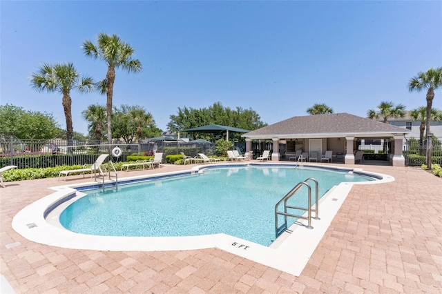 view of swimming pool featuring a patio