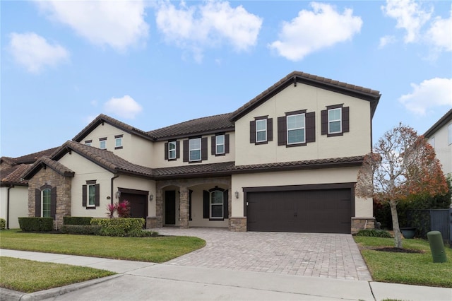 view of front facade with a front yard and a garage