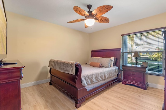 bedroom featuring ceiling fan and light wood-type flooring