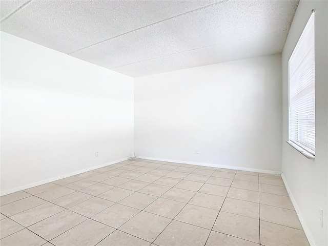 view of tiled spare room