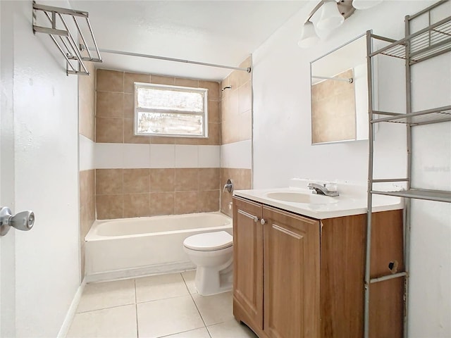 full bathroom featuring toilet, tile patterned flooring, tiled shower / bath combo, and vanity