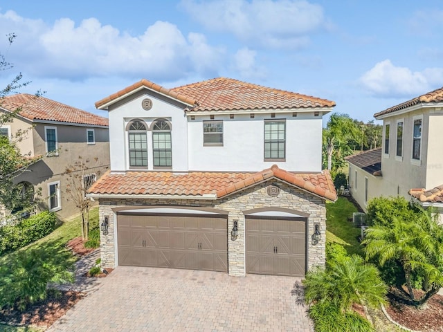 mediterranean / spanish-style house featuring a garage