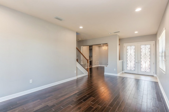 spare room featuring french doors