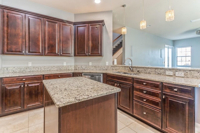 kitchen featuring light tile patterned floors, pendant lighting, a kitchen island, sink, and stainless steel dishwasher