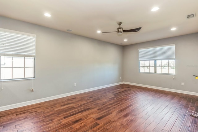 unfurnished room featuring ceiling fan and dark hardwood / wood-style floors