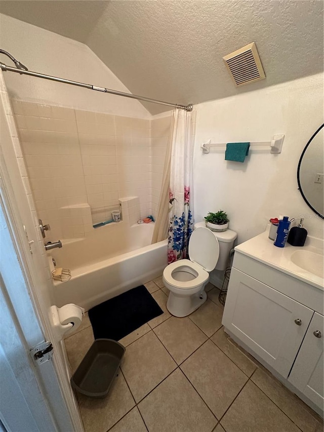 full bathroom featuring toilet, a textured ceiling, tile patterned floors, shower / tub combo, and vanity