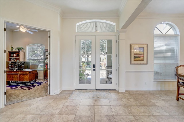 doorway featuring ceiling fan, a healthy amount of sunlight, french doors, and crown molding