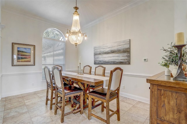 dining space with crown molding and an inviting chandelier