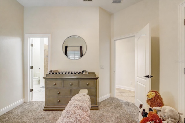 carpeted bedroom featuring connected bathroom