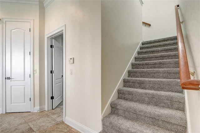 stairway featuring ornamental molding