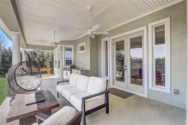 view of patio / terrace featuring an outdoor hangout area, ceiling fan, and french doors