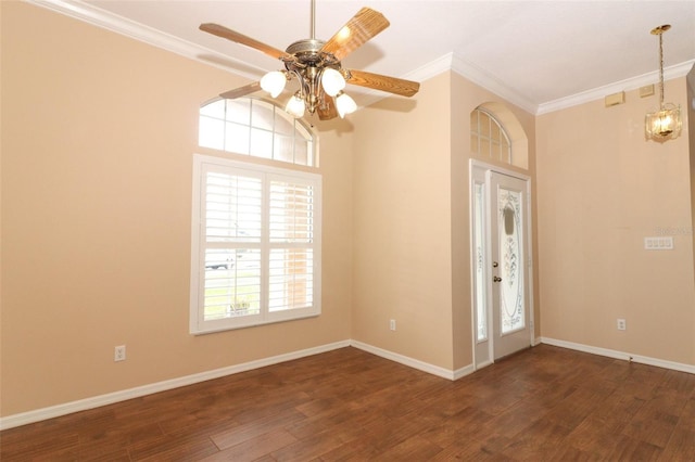 foyer entrance with ceiling fan, crown molding, and dark hardwood / wood-style flooring