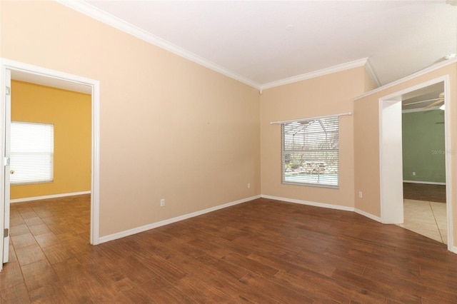 unfurnished room featuring ornamental molding and dark wood-type flooring