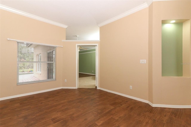 empty room with crown molding and dark wood-type flooring