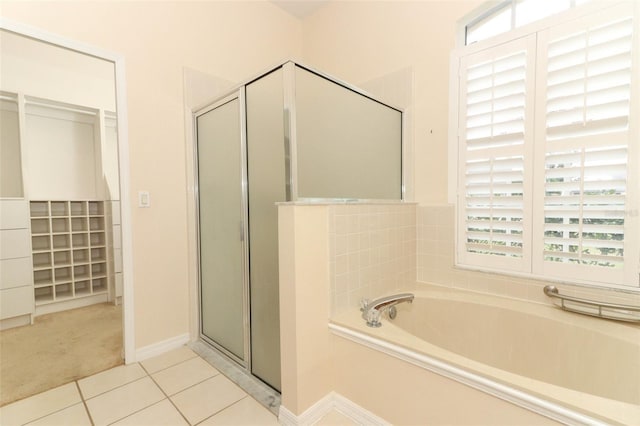 bathroom featuring plus walk in shower and tile patterned floors